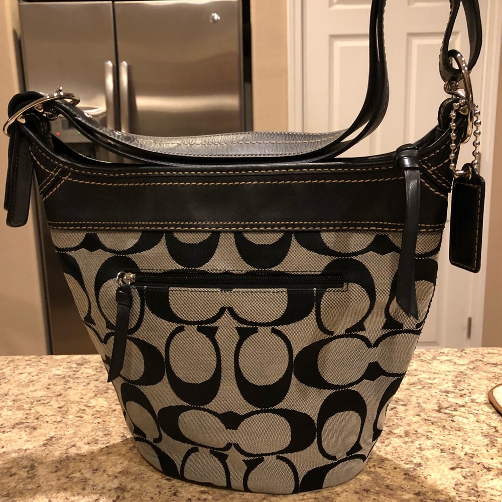 COACH Signature bucket purse, black and silver.